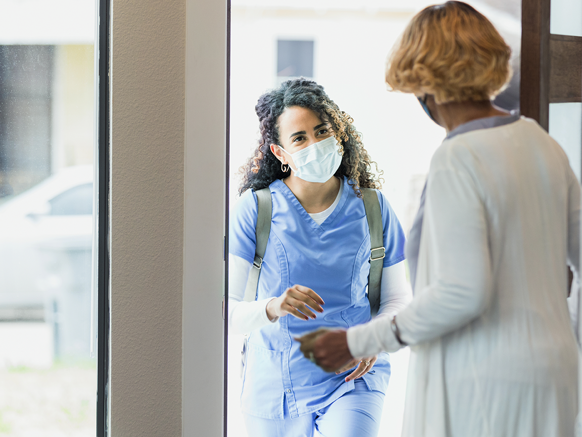 healthcare worker entering home